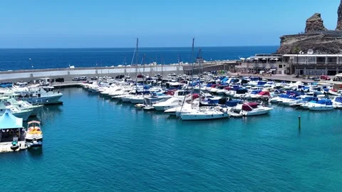 Vibrant Small Harbor Under Clear Blue Sky – Puerto Rico, Drone View Stock Footage 310142593