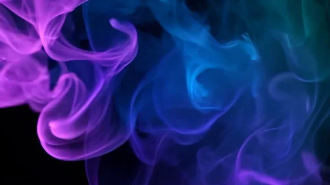 Vibrant smoke swirling dynamically, creating colorful abstract patterns against Stock Footage 310403978