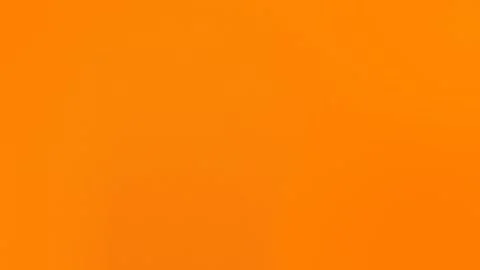 Vibrant solid orange seamless loop background. Smooth, uniform texture. 4K. Stockbeeldmateriaal 309058964