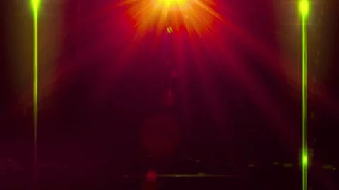 Vibrant stage lights shining bright. Glowing beams on dark background Stock Footage 334304896