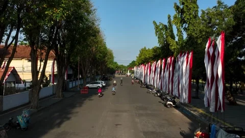 Vibrant Street in Banyuwangi, East Java with Festive Flags on a Sunny Day Stock Footage 333827531