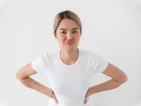 Vibrant studio shot featuring sassy woman with engaging expressions Foto stock