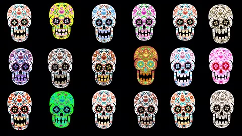 Vibrant sugar skulls in a colorful pattern Stock Footage 286146176