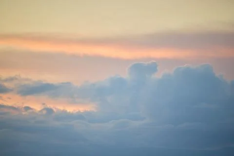 Vibrant Sunset Clouds over a Glowing Evening Sky Stock Photos