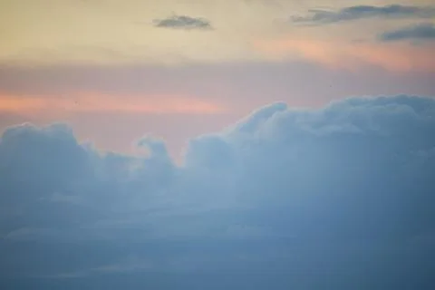 Vibrant Sunset Clouds over a Glowing Evening Sky Stock Photos