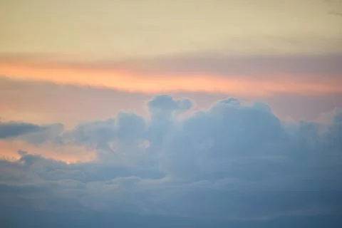 Vibrant Sunset Clouds over a Glowing Evening Sky Stock Photos