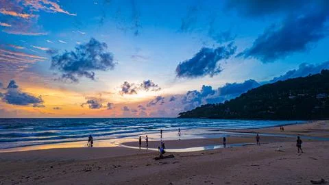 Vibrant Sunset Clouds Over Island at twilight Stock Photos