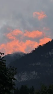 Vibrant Sunset Clouds Over Mountain Landscape Stock Photos