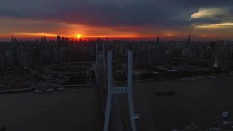 Vibrant Sunset Colors Above Modern Cityscape and Nanpu Bridge Shanghai China Stock Footage 346356182