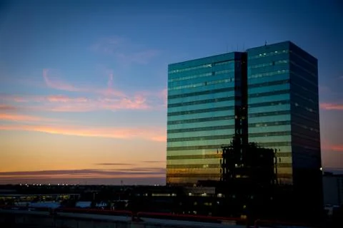 Vibrant sunset with a light reflection in the building Stock Photos