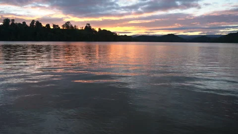 Vibrant sunset at mountain lake Video stock 247524361