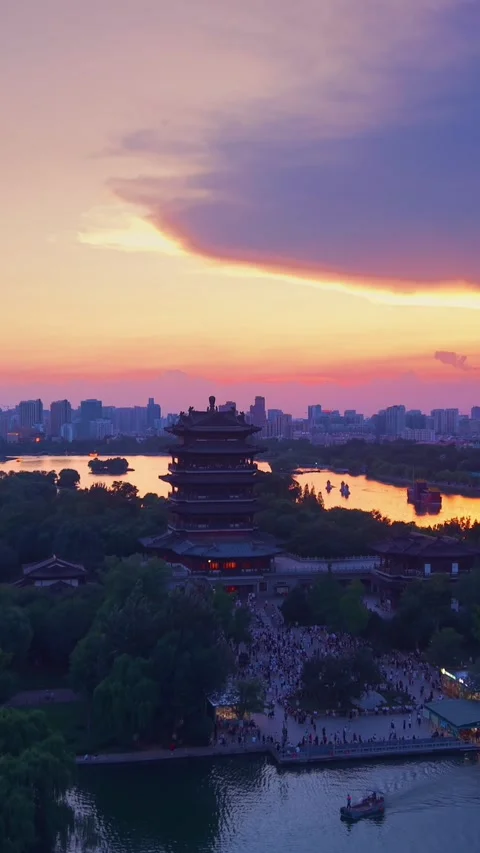 Vibrant Sunset over Ancient Chaoran Tower and Daming Lake, Jinan Stock Footage 331121246