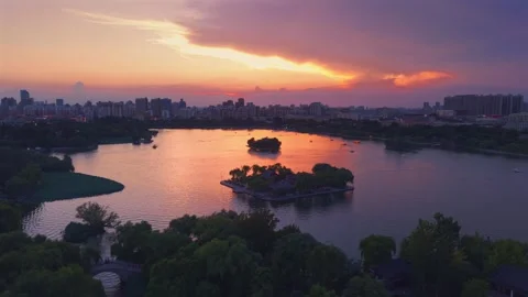 Vibrant Sunset over Daming Lake and Jinan City Skyline Stock Footage 331118537
