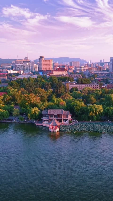 Vibrant Sunset Over Daming Lake and Jinan Cityscape Stock Footage 331118978