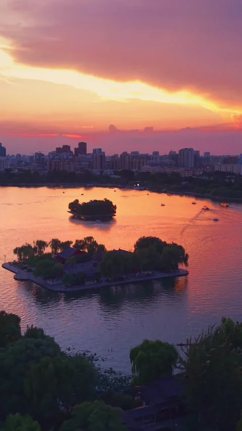Vibrant Sunset Over Daming Lake with Jinan City Skyline Stock Footage 331119285