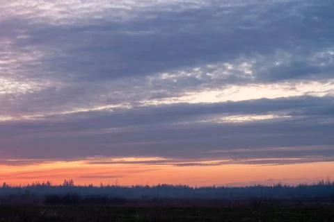 Vibrant Sunset Over Fields Stock Photos