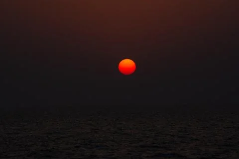 Vibrant Sunset Over the Ocean Stock Photos