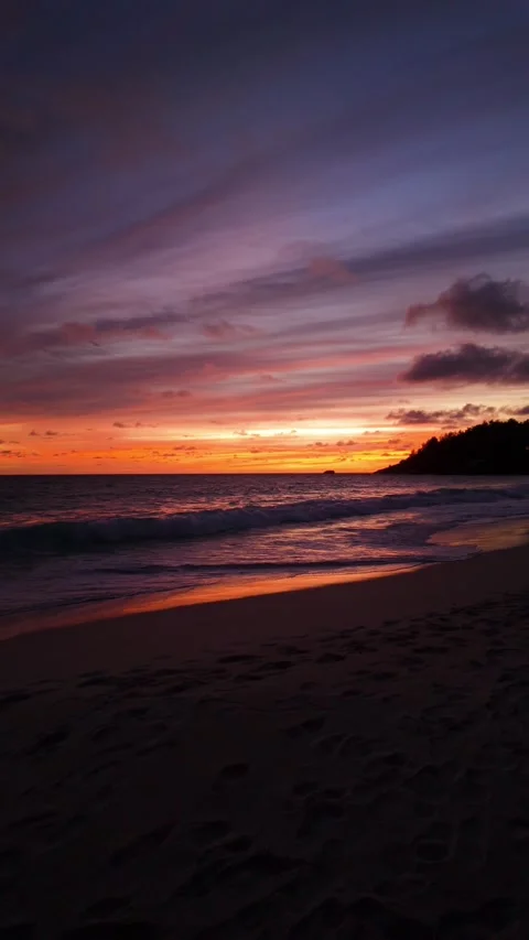 Vibrant sunset over the ocean with waves. Seychelles, Mahe. Stock Footage 301941773