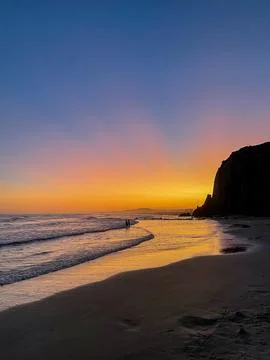 Vibrant Sunset Over Tranquil Beach Stock Photos