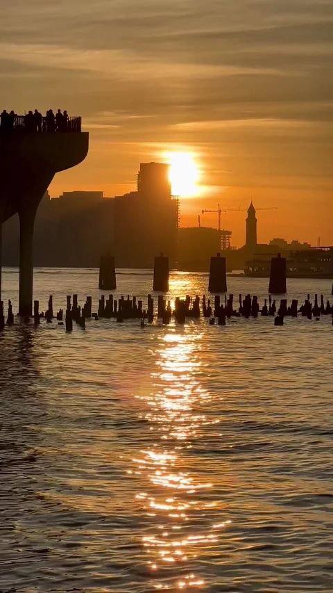 A vibrant sunset paints the sky over Hoboken Stock Footage 286401701
