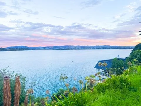 Vibrant sunset sky with dramatic orange and blue clouds New Zealand Фото