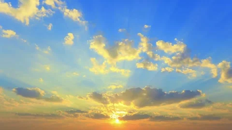 Vibrant Sunset Sky with Golden Clouds and Sun Rays Stock Footage 310923830