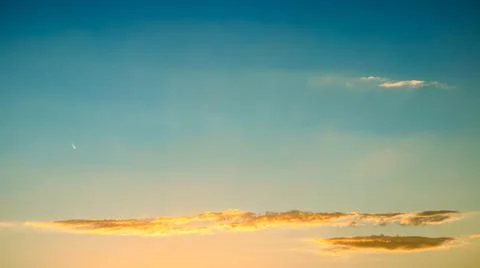 Vibrant sunset sky with soft clouds, perfect for wallpapers and text overlays Stock Photos
