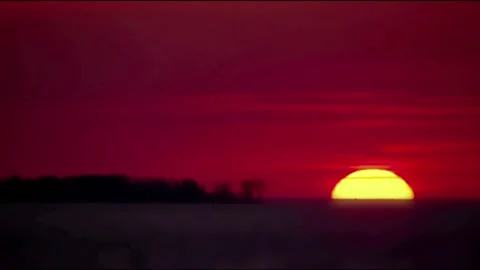 Vibrant Sunset Time-Lapse Over Silhouetted Horizon Video stock 327266161