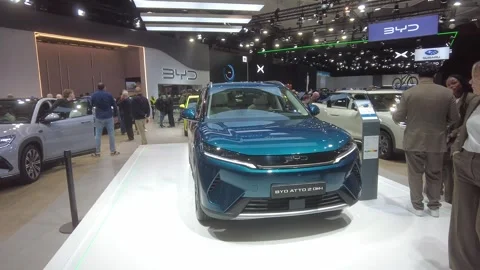Vibrant teal byd atto 2 dm i showcased bright white platform 2026 brussels motor Stock Footage 328207685