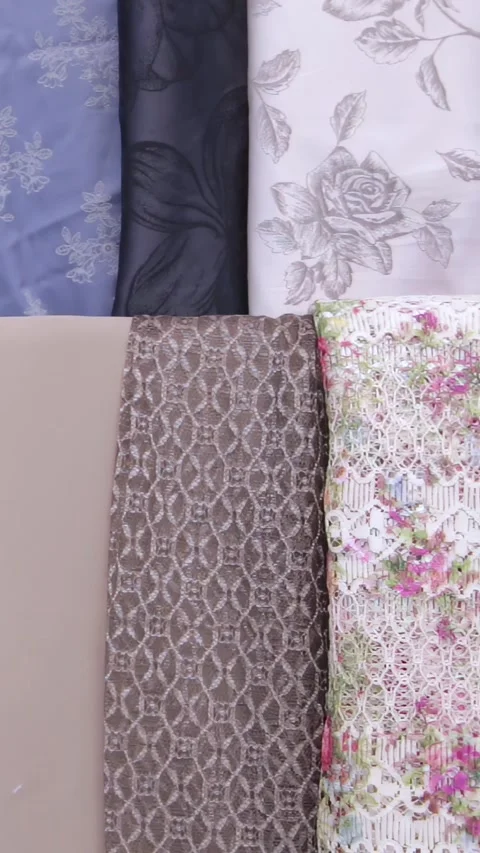 Vibrant Textile Rolls Artfully Arranged in a Daytime Shop Stock Footage 344617717