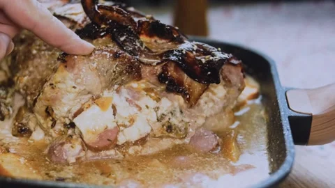 Vibrant textured food: serving thick slices of bacon wrapped tenderloin Stock Footage 342186587