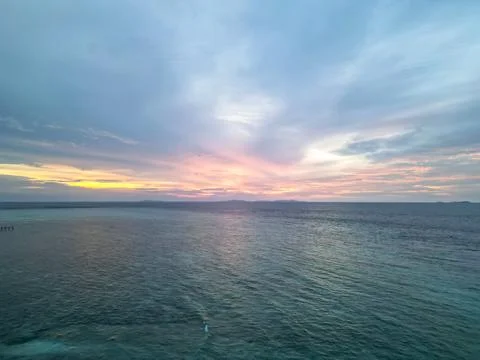 Vibrant Tropical Sunset Over Calm Ocean Waters in Indonesia Stock Photos