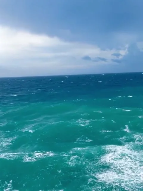 Vibrant Turquoise and Deep Blue Ocean Color Contrast Stock Footage 339774574