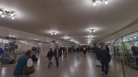 A Vibrant Underground Passageway Filled with Diverse Commuters Going About Their Vídeo Stock 295073078