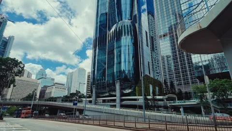 A vibrant urban scene featuring a mix of modern architecture and lively city 库存影片 338311563