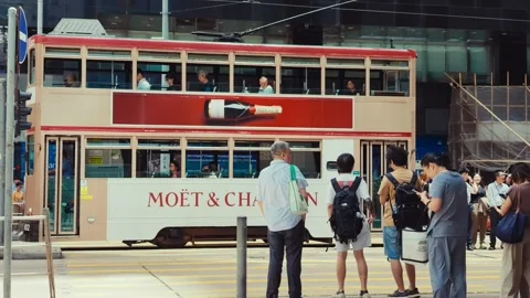 A vibrant urban street intersection with modern and classic transportation, Stock Footage 338311488