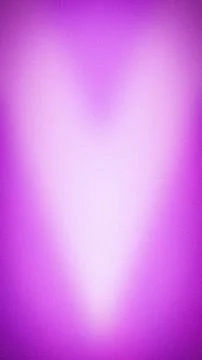 Vibrant vertical background featuring a grainy purple and fuchsia light bea.. Stock Photos