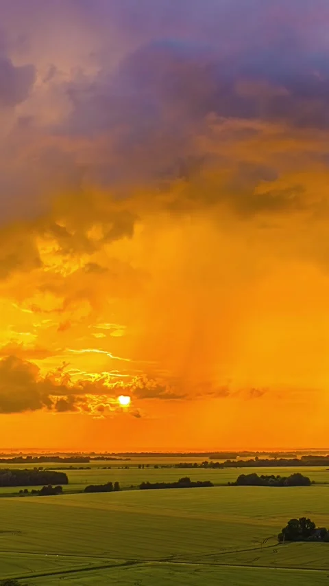 Vibrant Vertical Timelapse of Sunset Over Tranquil Fields Stock-Footage 329219467