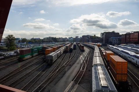 Vibrant view through red-framed windows of Vancouver's rail yard and port, .. Stock Photos