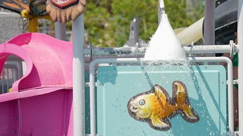 A vibrant water feature with a fun fish design for childrens maximum enjoyment Stock Footage 311993834