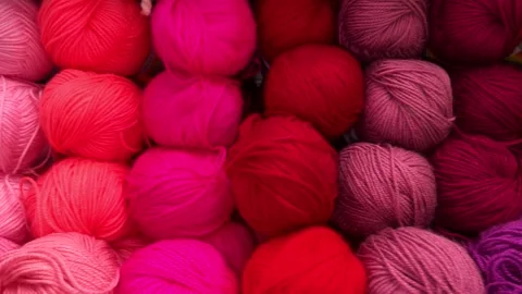 Vibrant yarn balls in various colors arranged for knitting and crafting projects Stock Footage 337071595