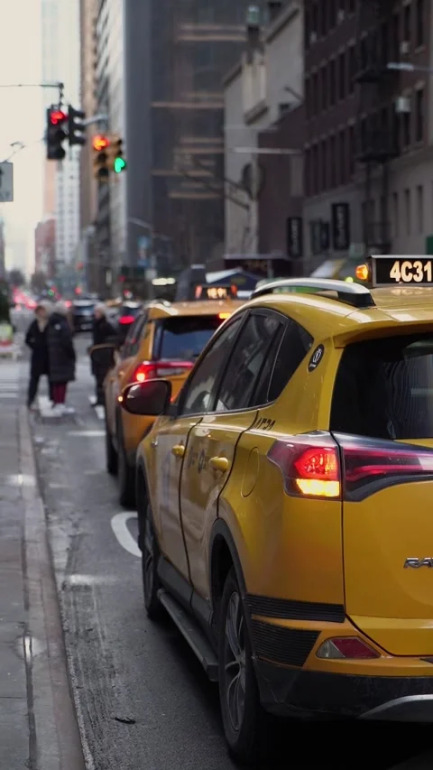 The vibrant Yellow Cabs navigating through the bustling Urban Cityscape Traffic Vidéo 291615718