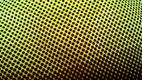 Vibrant yellow dot pattern texture moving in hypnotic digital animation video Stock Footage 341770820