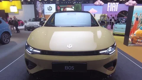 Vibrant yellow leapmotor b05 positioned body stance 2026 brussels motor show Stock Footage 328206071