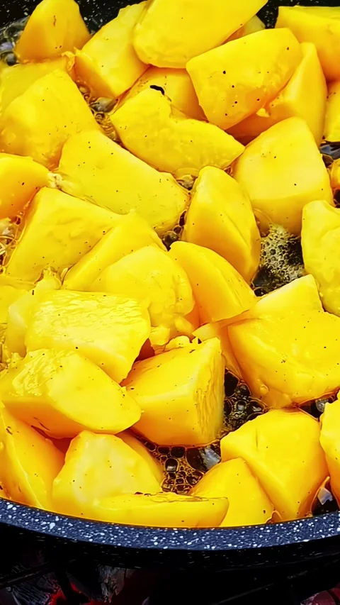 Vibrant Yellow Squash Simmering in a Pan Stock Footage 337929740