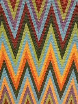 Vibrant zigzag textile pattern with colorful chevron stripes, ideal for fabric d Stock Photos