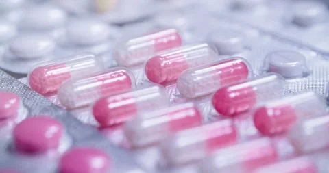 Vibrantly colored Capsules and Pills arranged in Blister Pack 動画素材 302901507