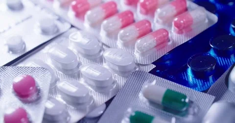 Vibrantly colored Capsules and Pills arranged in Blister Pack 動画素材 302901606