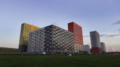 Vibrantly Colored Modern Architectural Structures Set Against the Evening Sky Vídeo Stock 281027469