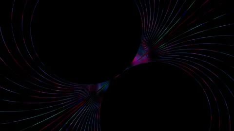 Vibrantly colored neon energy light trails curve against black background in a 库存影片 334816616
